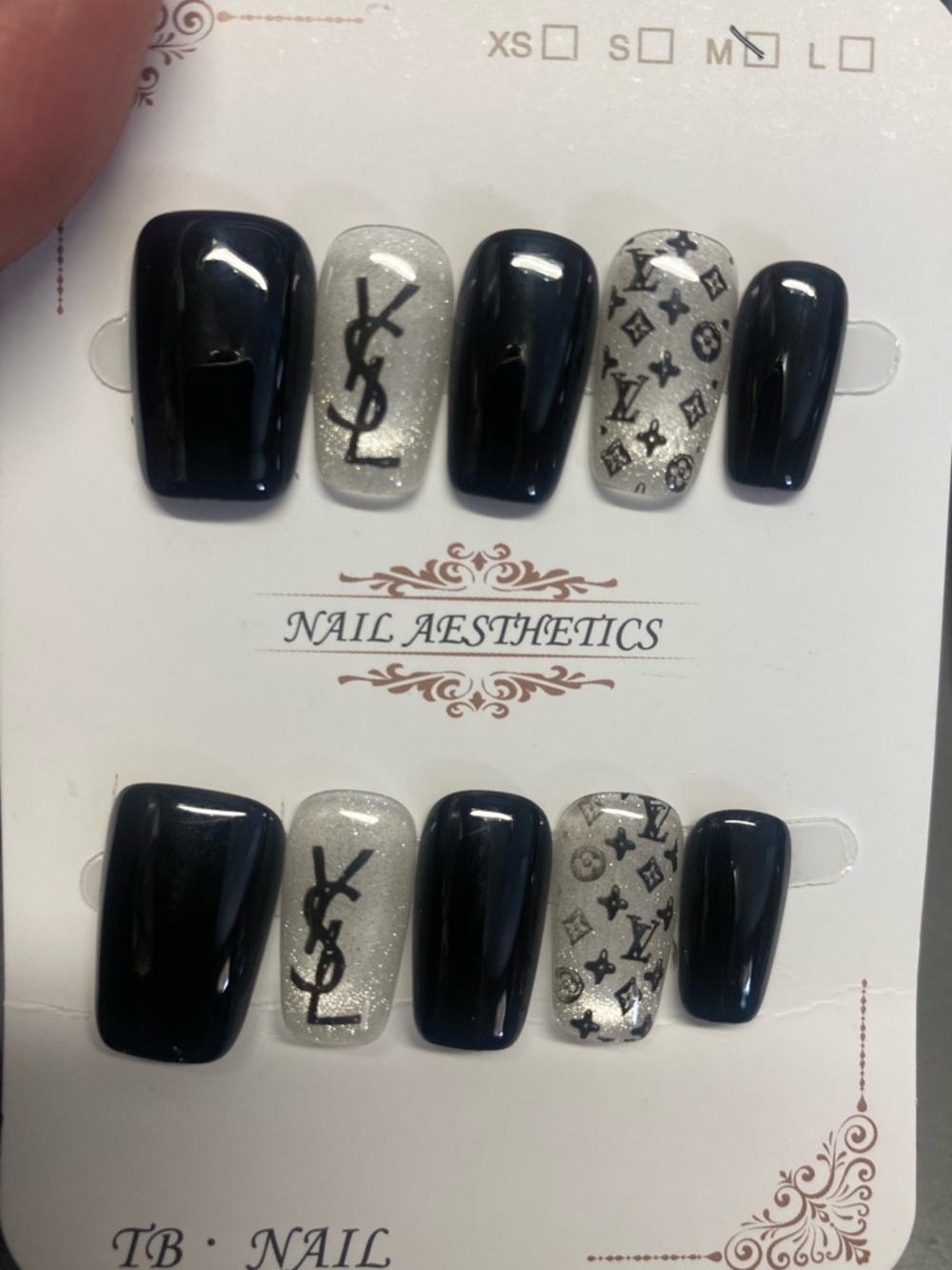 Black & Silver Logo Accent Press-On Nails and a set of magnetic eye lashes